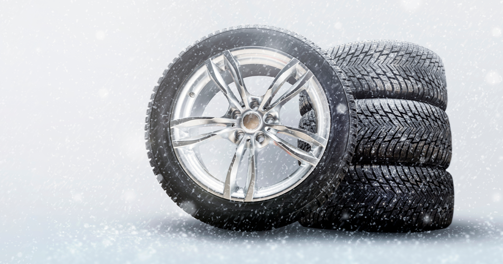 A winter image of tires in a snowy setting.